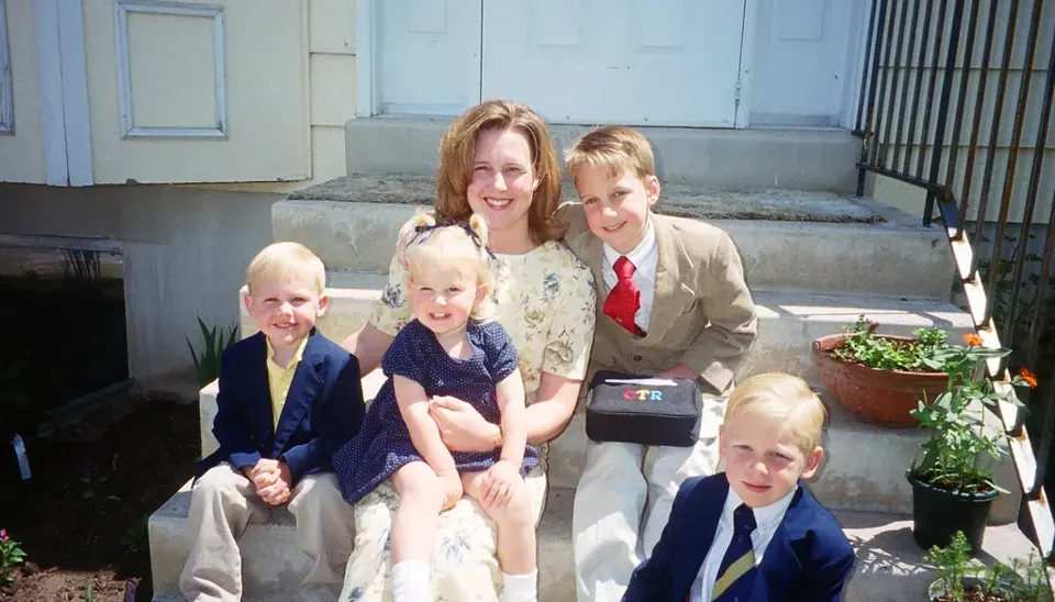 A family on the front steps · 2000